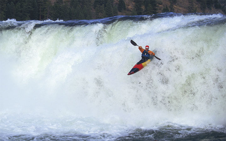 What Should You Do When Approaching a Low-Head Dam in a Canoe or Kayak?